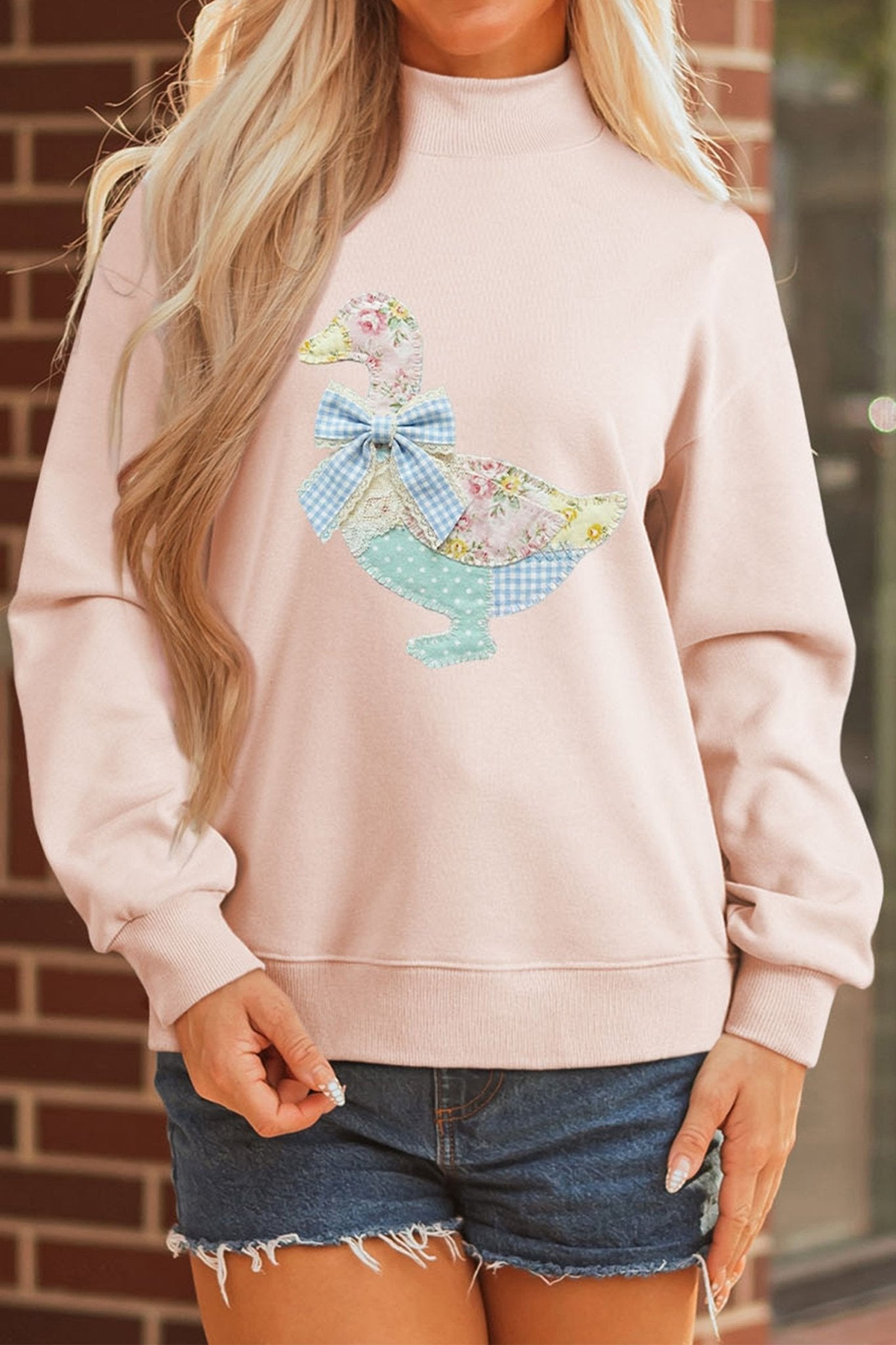 Apricot Pink Bow Knot Duck Faux Patchwork Printed Mock Neck Sweatshirt - Loving It Shop