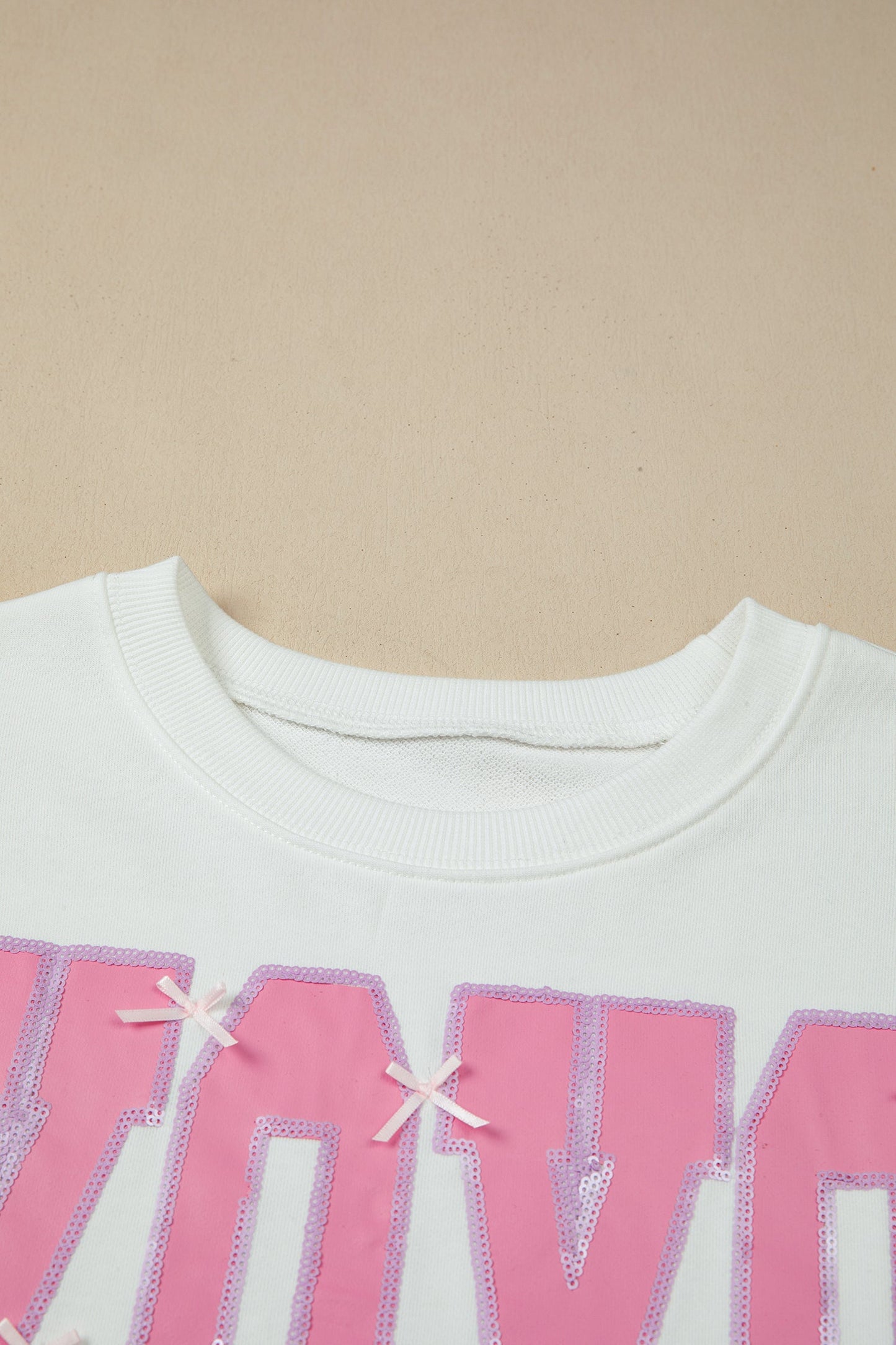 White Bow Sequin XOXO Letter Graphic Exposed Seam Baggy Sweatshirt