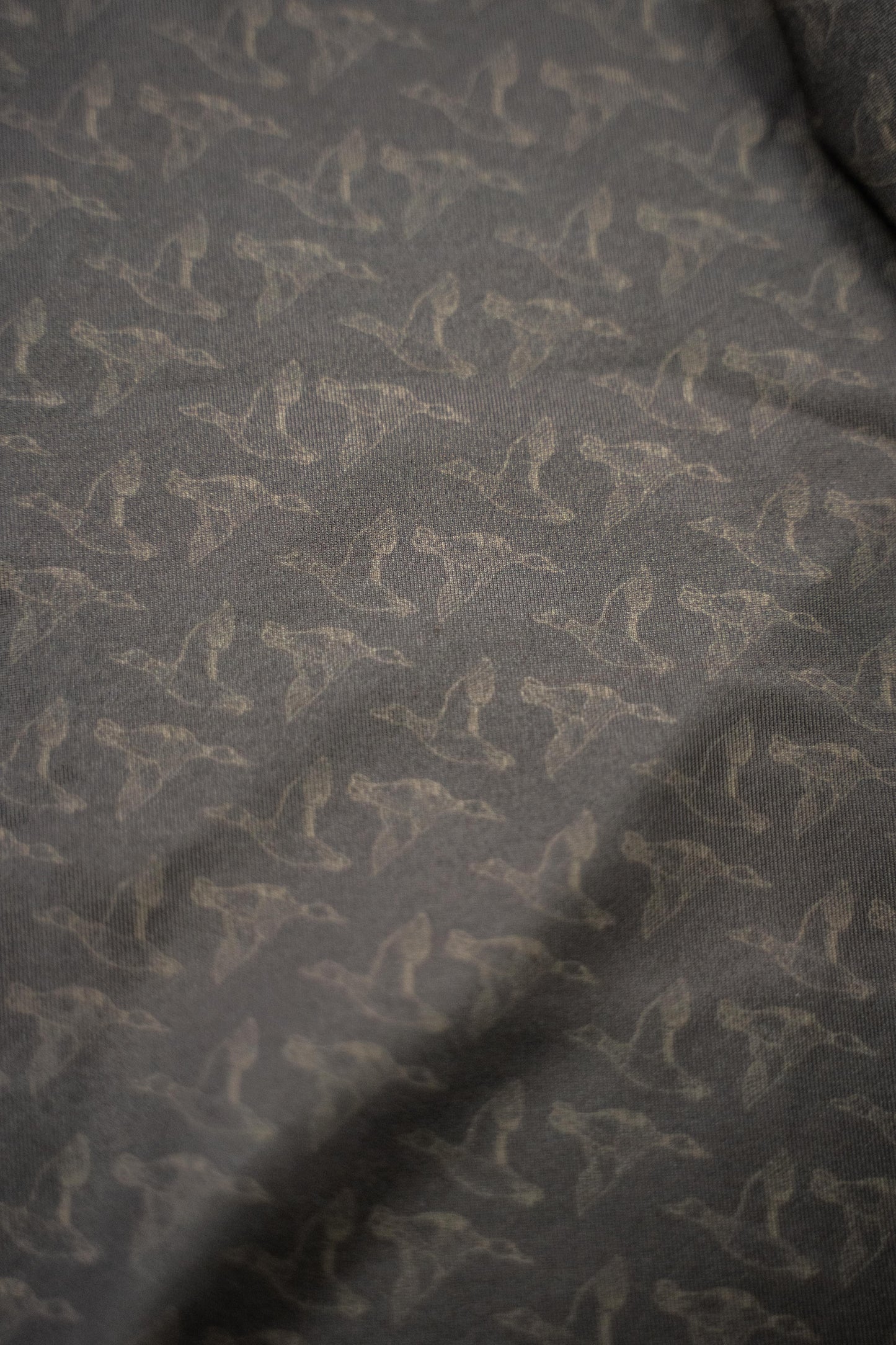 Mallards Golf Polo showcasing a stylish, comfortable performance golf shirt with a unique pattern and tag.