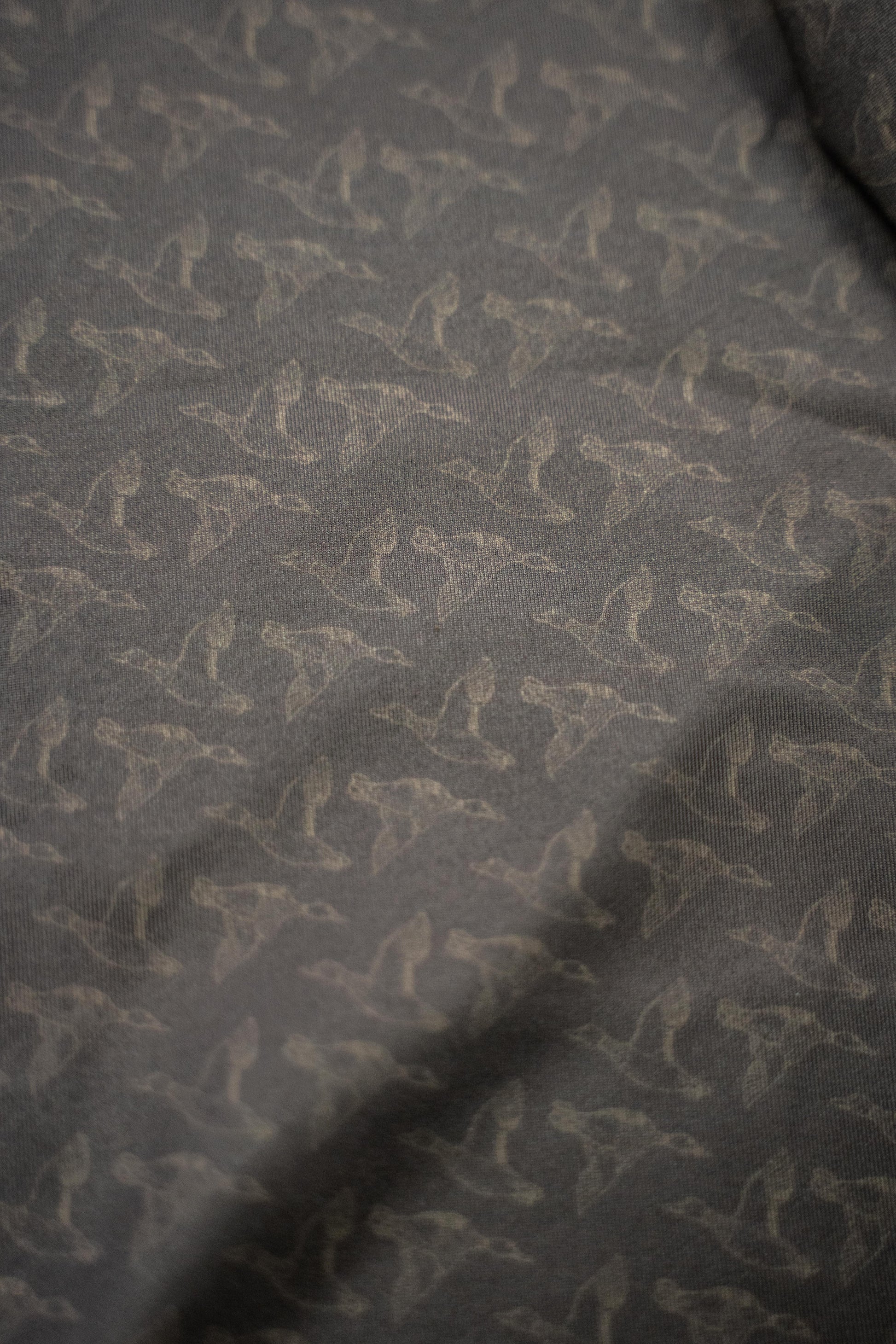 Mallards Golf Polo showcasing a stylish, comfortable performance golf shirt with a unique pattern and tag.