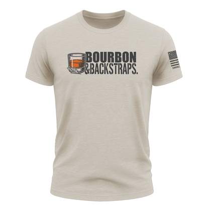 Bourbon &amp; Backstraps Tee Sand featuring a whiskey glass graphic on a sand-colored premium hunting t-shirt.