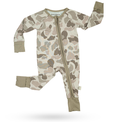 Button Buck Camo Baby Zippy in soft camouflage design, perfect for outdoor-inspired baby outfits.